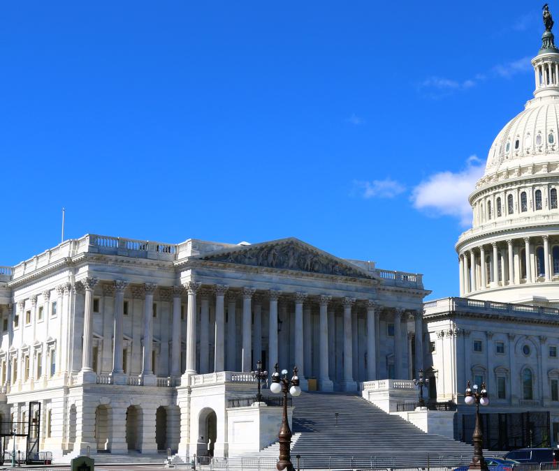 Capitol dome against blue sky